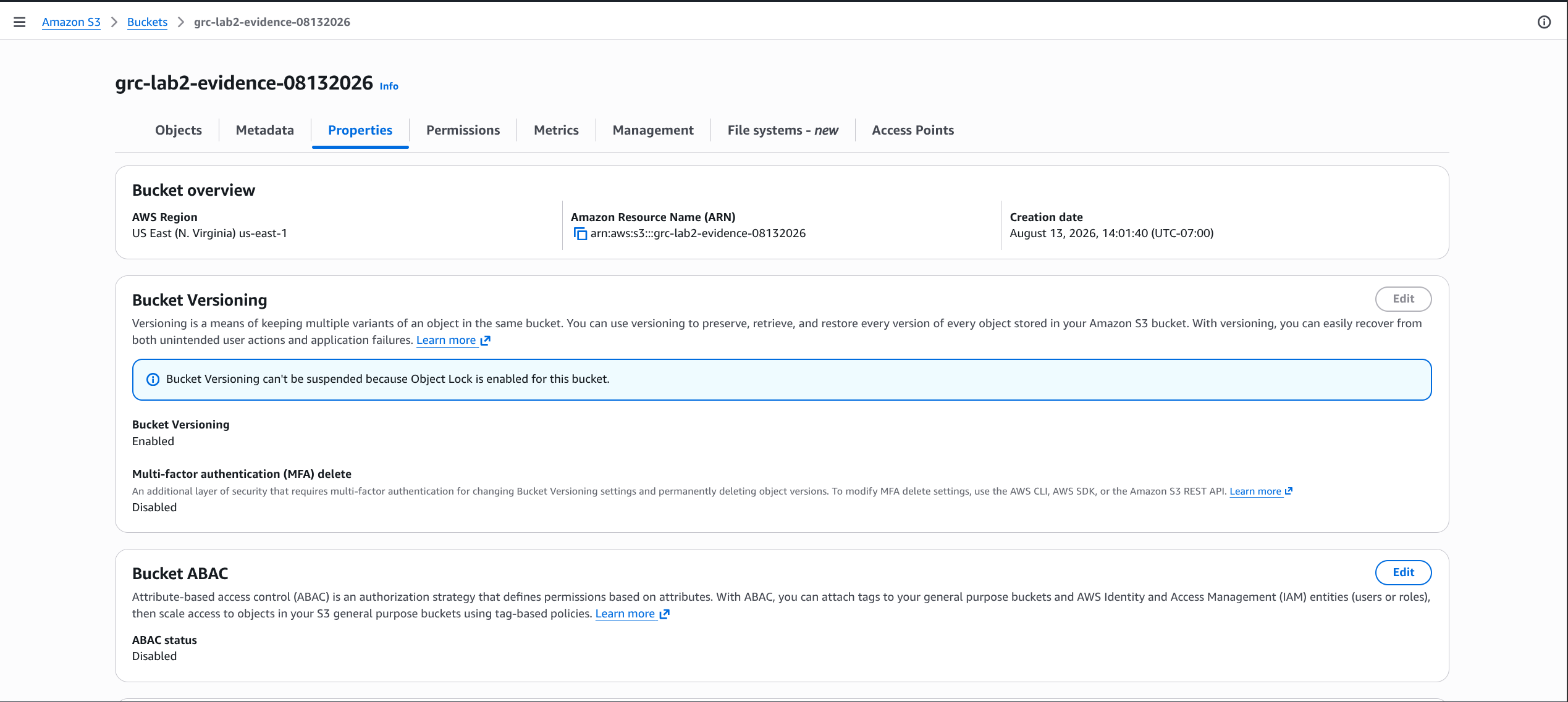 AWS S3 bucket properties page for grc-lab2-evidence-08132026 showing Bucket Versioning Enabled and blocked from suspension because Object Lock is active.